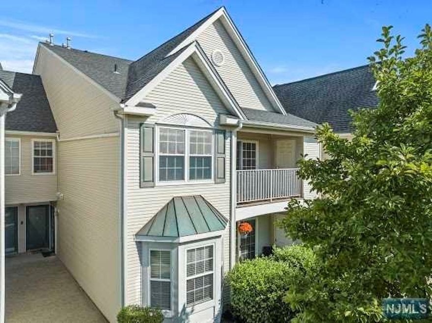 Don't miss out on this exceptional opportunity to own the largest unit in private gated community,situated just minutes away from NYC bus and train station! This multi-level townhouse is move-in ready.It boasts 2 spacious bedrooms,each with its own private full bath.The open concept Kit and Liv/Din combo is perfect for entertaining guests w/sliding doors that leads out to balcony overlooking the pool and greens for fresh air and relaxation. Renov kitchen features granite Cntp,SS Appl and high cabinets, providing a modern and stylish space.Cathedral ceilings w/ upgraded high-quality LED flush lights add an extra touch of elegance and grandeur to the space.Private upper-level loft can be used as 3rd BdRm,family Rm or gym.Washer and dryer in unit.Gleaming Hdwd Flrs throughout the house,recessed lighting and newer HtWtHtr.This is a pet-friendly community offering pool&gym.Close to NYC transp,major Hgwys,schools,shops and local restaurants. COMMUTERS DELIGHT!