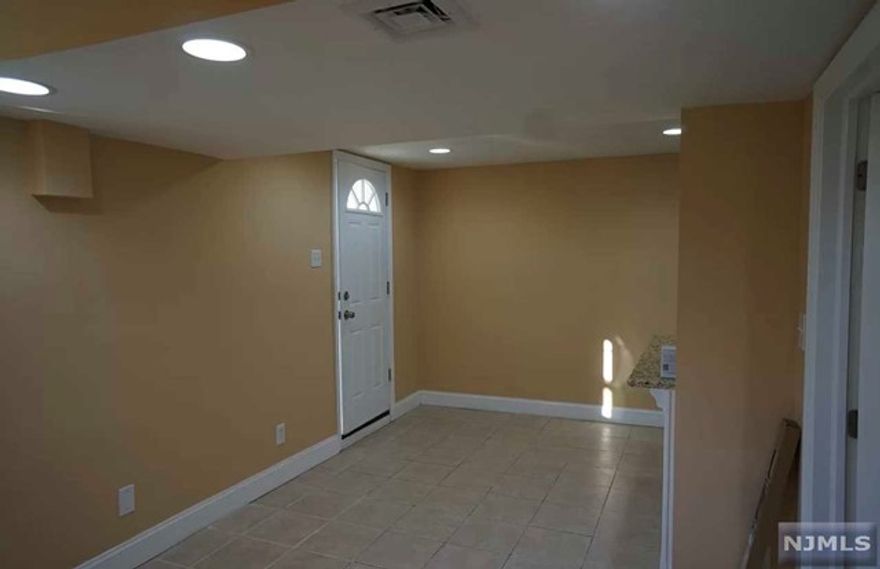 Beautifully renovated apartment on ground floor close to all shopping, NJIT, Rutgers-Newark, Prudential Center, and Harrison path. This unit offers a nice living room, eat in kitchen, nice bathroom with shower, good size bedroom and use of laundry! Heat and Hot water is included, tenant regulates temperature