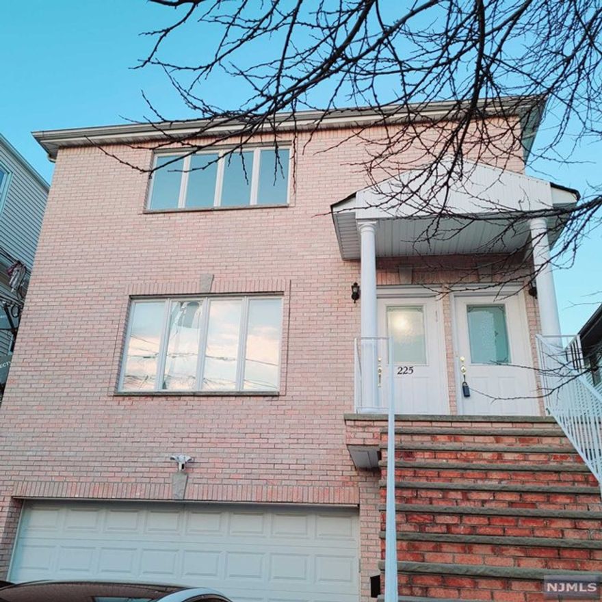 Experience luxury living 15 minutes from NYC in this renovated, freshly painted, spacious and elegant 3 bedroom, 2 bathroom apartment. The open floor plan and natural light create a warm and inviting atmosphere. Enjoy the convenience of central air conditioning and vacuum baseboard heating, hardwood floors throughout, and a balcony that provides a serene outdoor space. The unit also includes an in-unit washer and dryer and 2 car parking. With over 1500 square feet, this unit is designed for comfortable living. The location is ideal, just steps away from transportation, shopping, schools, and houses of worship. Don't miss the opportunity to make this unit your new home. CALL/TEXT 201-873-8551 FOR THE SHOWINGS. Interview is required.