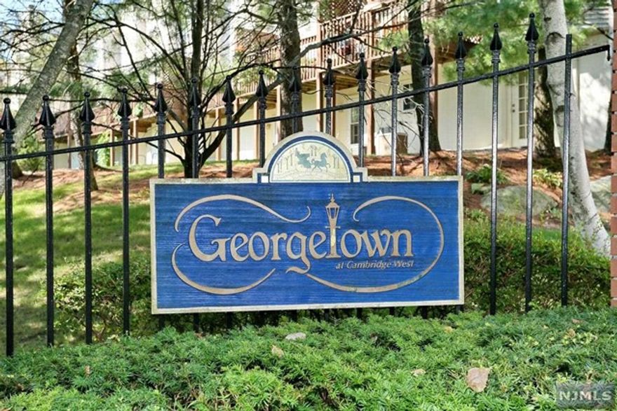 Located in the desirable Georgetown section of Cambridge Heights, this 3 level updated townhome will not disappoint! The eat-in kitchen with meganite countertops and stainless steel appliances adjoins the sun filled eating area. There are laminate floors on the entire first level. The living room/dining room has a wood burning fireplace and access to a private deck. A powder room completes the first floor. Upstairs you will find a primary suite complete with an updated bath and several closets. There is an additional bedroom, full bath and laundry on this level. The lower level has a family room with newer laminate flooring and carpet with access to a private patio & the garage. Georgetown has its own pool for summer fun, basketball facilities, as well as 24 hour gated security. The town of Ramsey has wonderful shopping, restaurants and public transportation to NYC and one of the best farmer's markets around!