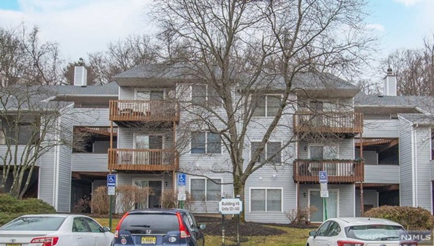 Lovely 3 bedroom, 1.5 bath, 2nd floor end unit in desirable Pinebrook Village! This spacious condo incl. large living room w/sliders to outside deck, dining room w/HWF, & beautifully renovated kitchen w/extra cabinet/counter space, granite CT & SS appliances. LR & DR have 2 walls of windows offering plenty of natural light. The master bedroom has vaulted ceilings & is complete w/WIC & FB. There is an addl. guest BR, powder room, laundry room & 3rd bedroom that is currently setup as a den that can be converted back easily. Other feat incl. central air, huge addl. storage room & bonus pull down attic, sunset views from the deck, floor to ceiling custom adjustable built-in shelving, LOW HOA, & more! Pinebrook Village has a beautiful pool & playground & is close to transportation, shopping, major highways & restaurants! Unit is set back off the road surrounded by tree lined views & is just a short walk to the pool!