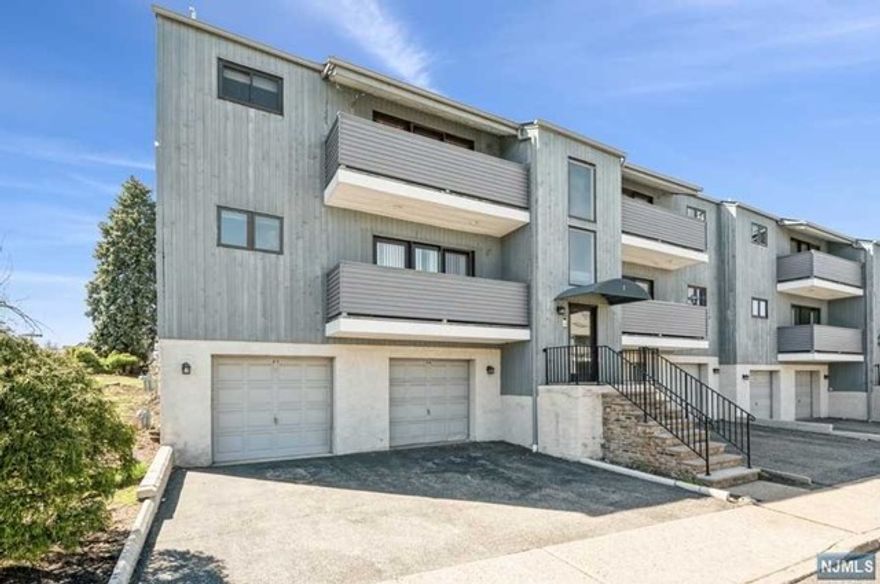 Spacious condo conveniently located offering 2 bedrooms and 2 bathrooms. An open floor plan has a living room with balcony, dining room and kitchen. Main bedroom has full bath and balcony. Second bedroom has ample closets. Laundry is in unit and there is a huge storage space behind the garage space that could be used as a gym, man cave, secret hideaway.