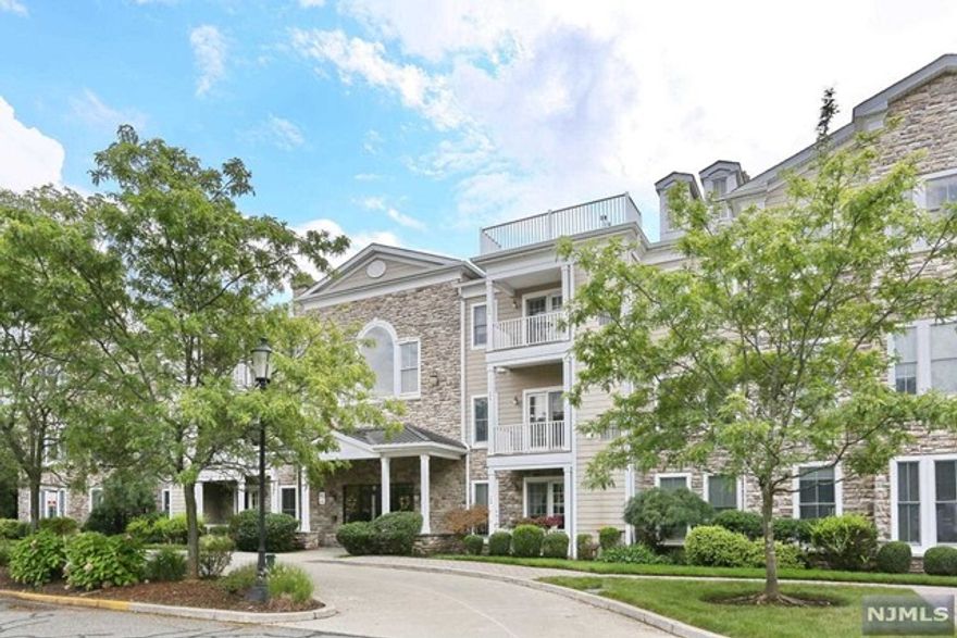 Lovely two bedroom two bath unit in the Cresskill Commons which is 55+ community. This end unit has an open floor plan. On entering there is a large coat closet leading to the large open area for the living room, dining area, and modern kitchen. New refrigerator just installed with ice maker. The primary bedroom has large closet that was designed by Container Store, beautiful bathroom with walk in shower. The second bedroom has large closet also designed by the Container store for maximum use. Freshly painted last year and hard wood floors and two outside parking spaces included #74,25