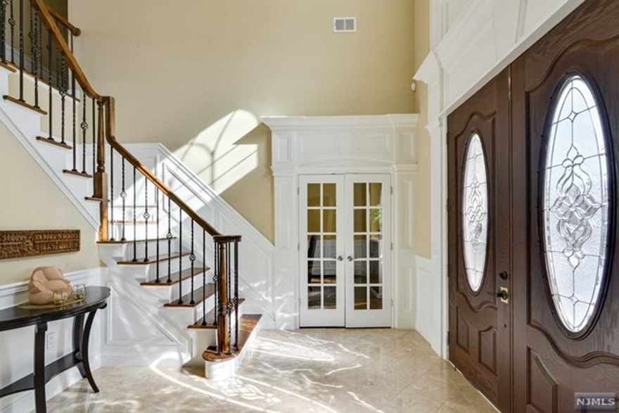 Rent this Fabulous 5 Bedroom,5 1/2Bath all Brick Center Hall Colonial in the most prestigious town of Demarest. Enter into a Grand 2 story Marble Foyer flanked by a large living room and dining room. Continue into the gourmet eat-in Kitchen with top of the line appliances and radiant heat that leads into the bright and sunny Family Room w/fireplace,a Bedroom/Full Bath and 1/2 Bath completes the first level. Follow upstairs to a large Mstr.Bdrm/Mstr.Bth, with 2 walk-in closets,fireplace and a Mstr/Bth with radiant heating. In addition to Mstr/Bdrm, 1 Bdrm with a walk-in closet and en-suite bathroom, plus 2 additional bedrooms and a hallway bath and a laundry room completes the 2nd level. Spacious basement with a full bath.Additional features: 3 car garage, paver driveway,large backyard with a patio.Wooden floors throughout, multiple zones of heat and air, walk to elementary and middle school.Last but not the least Demarest has one of the top rated school districts in Northern NJ.