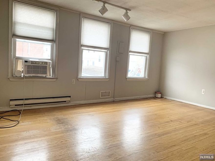 Enjoy the privacy of this apartment tucked away off the street! Walking distance to NYC buses and a few minutes drive to major highways. Unit boast wood floors throughout, and open living/dining area. Separate utilities, and 1 off street parking spot is included.