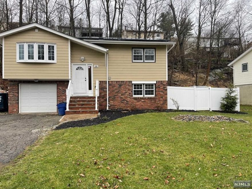 Whole house for rent. Updated Bi-Level features 2 full levels of finished space, approx 1700 sqft! Tenant enjoys lower cost electric and landlord paying the solar lease (solar panels included). First floor features open concept floor plan with Kitchen, dining room, living room, deck access, 2 bedrooms and full bath. Ground floor features laundry, 3rd bedroom, half bath, family/rec room or flex space with a walkout to backyard and garage. Oversized single car garage for storage or parking. New hardwood and vinyl flooring. Newer windows, and wall unit air conditioner. Lease includes use of yard, parking, laundry room, garage opener, new ceiling fans, new deck, dishwasher, microwave, stove, and water softener. Minimum credit 600, minimum income $90k/year; tenant reports/NTN/or equivalent required for background screening. Tenant pays 1 month advance, 1 month fee, 1.5 month security, all due at signing. Maximum pet size is 25lbs, adds $25/pet to monthly rent, max 2; no cats.