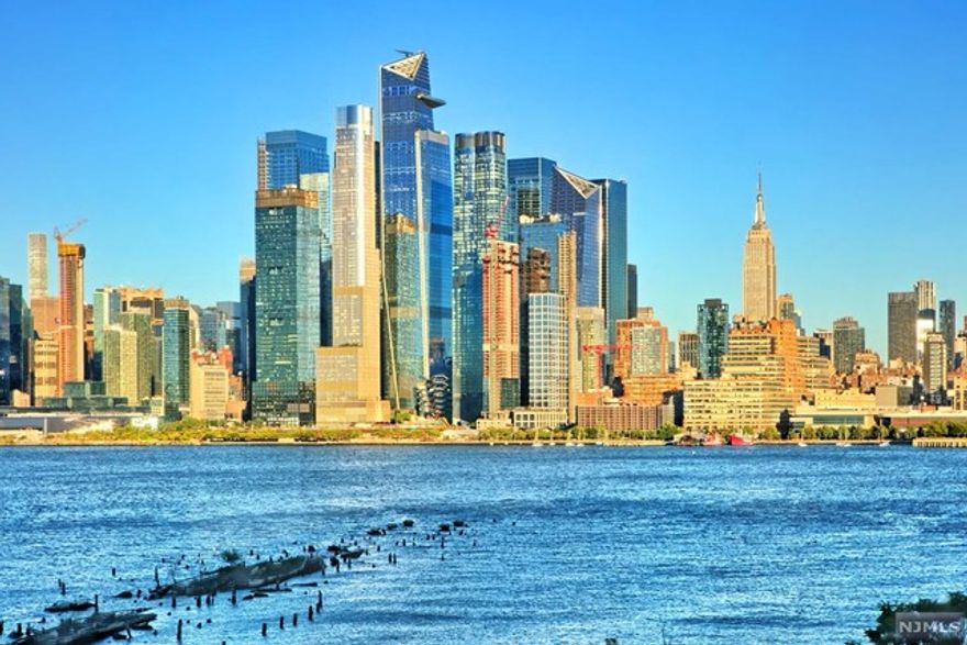 **OH - 10/15 Saturday @ 12pm-2pm** Visit this well sought after 2br/2ba corner residence with spectacular views of NYC and the Hudson River. Enjoy 1510sqft of expansive living space 15ft ceilings, mirage flooring, recessed lighting and broad sunlit windows w/ incredible views throughout. Kitchen is fully equipped with new Jenn Air Kitchen appliances and offers loads of cabinetry, mosaic tile backsplash and granite counters. This residence includes a generous master bedroom w/ overhead wall storage unit, ceiling fans, built-in wardrobe/closet in both bedrooms and incredible NYC views and en-suite bathroom. Bath is detailed in ceramic tile, granite topped storage vanity and soaking tub. The second large sized bedroom features double closets and direct access to the dual entry modern bath with ceramic tile detail, soaking tub and granite storage vanity. There's also a ceiling LED track lights in all rooms and remote-controlled Hunter Douglas shades. Reserved parking is included.