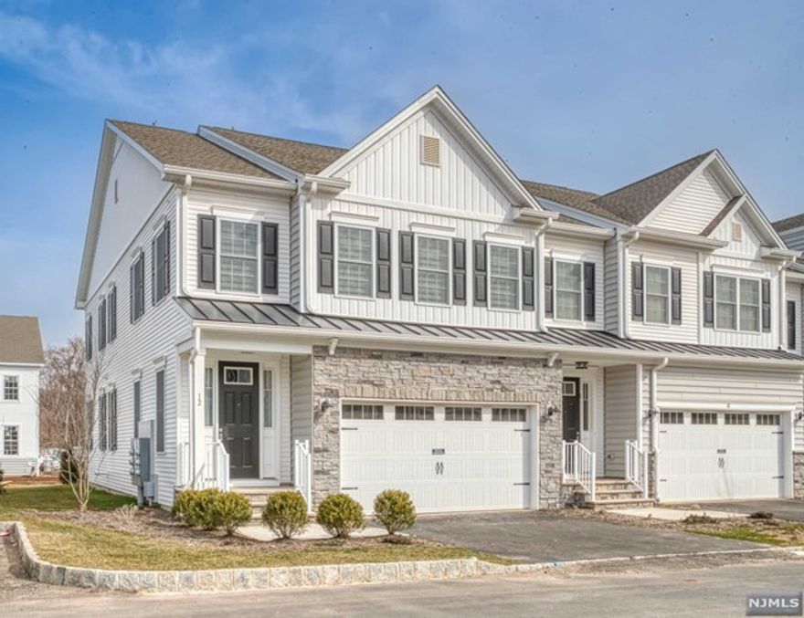 Welcome to this beautiful town house located at the Enclave in Old Tappan. A bright and spacious end unit offering 3 Bedrooms and 3.5 Baths, hardwood floors throughout, gourmet kitchen with sliding glass doors leading to a patio. Primary bedroom suite, sitting area, two additional bedrooms and a full bath and laundry room on 2nd floor. A finished basement which can be used as a family room and a full bath. Two car attached garage. Close to schools, close to shopping. A must see!!! Owner holds NJ real estate license.