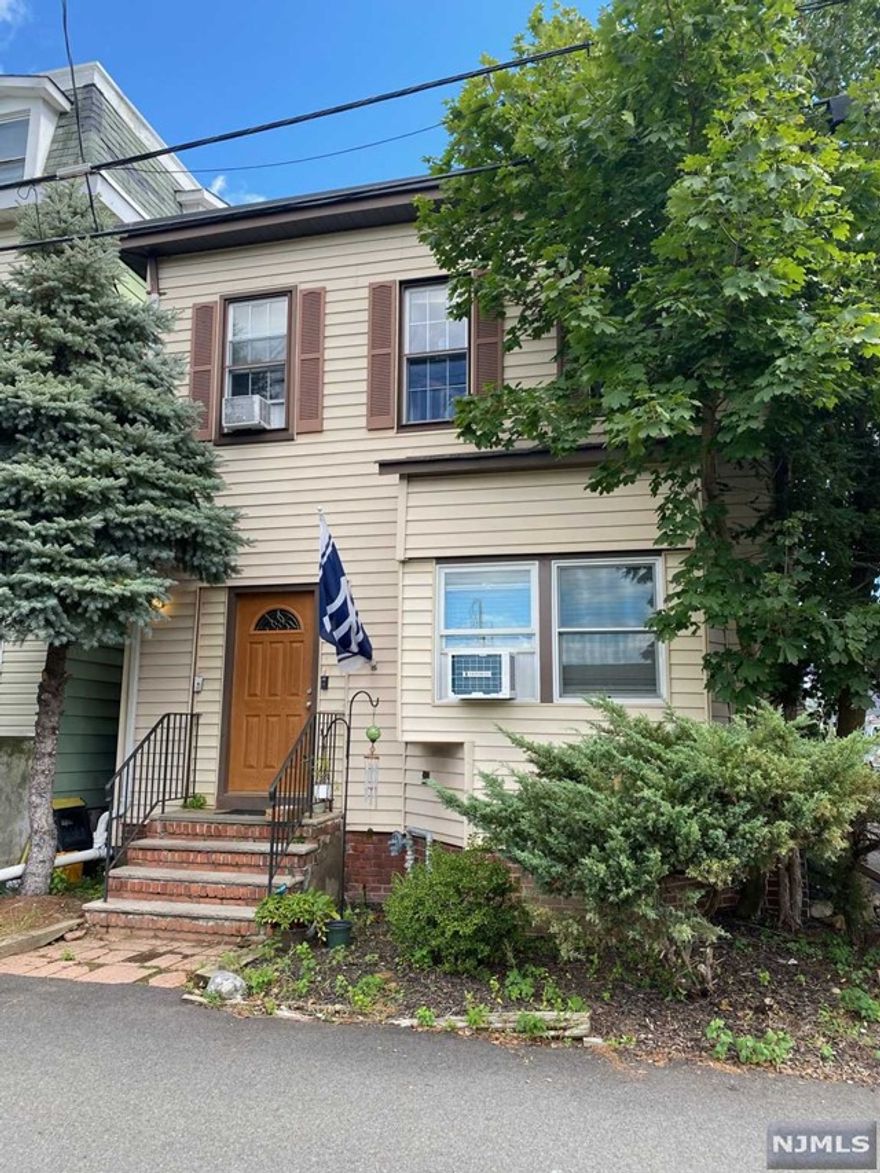 Renovated first floor 1 bedroom, 1 bathroom apartment in a well maintained 3 family home. Open and airy living space with wood floors throughout the kitchen and living room area. Kitchen has stainless steel appliances and a breakfast bar. Bedroom has plenty of closet/storage space. Private laundry in unit. Driveway parking for 1 car. Close to shopping, restaurants and all local conveniences, public transportation near by, close to NY border and major highways. Excellent credit is a must.