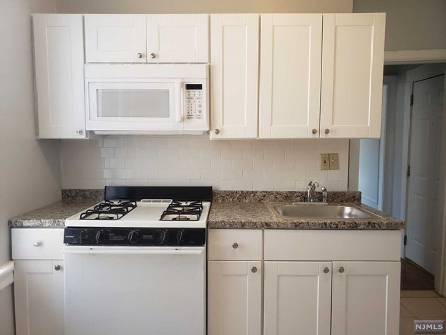 Jersey City pre-war building offering a spacious one bedroom condo unit with 526 sq ft and good layout in Journal Sq area. Close to parks, schools, shopping and path. HOA fees include heat, hot water and laundry facility. Freshly painted, new countertops, cabinets, microwave and flooring in the living room. Updated bathroom, hardwood floors and 2 good size closets. No refrigerator in unit. NO ELEVATOR in building. On-site super. One small pet, cat OR dog permitted under 20lbs.