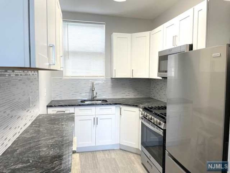 Beautifully renovated top to bottom apartment light and bright. Completely renovated kitchen granite counters, stainless appl., granite breakfast bar with stools. Master bedroom with two closets. Lg living room with two windows. Completely renovated bathroom with beautiful tiles. Hardwood floors. Fabulous location. Close proximity to all NYC transportation, shopping and restaurants. Apartment above stores. Move right-into this beautiful apartment.