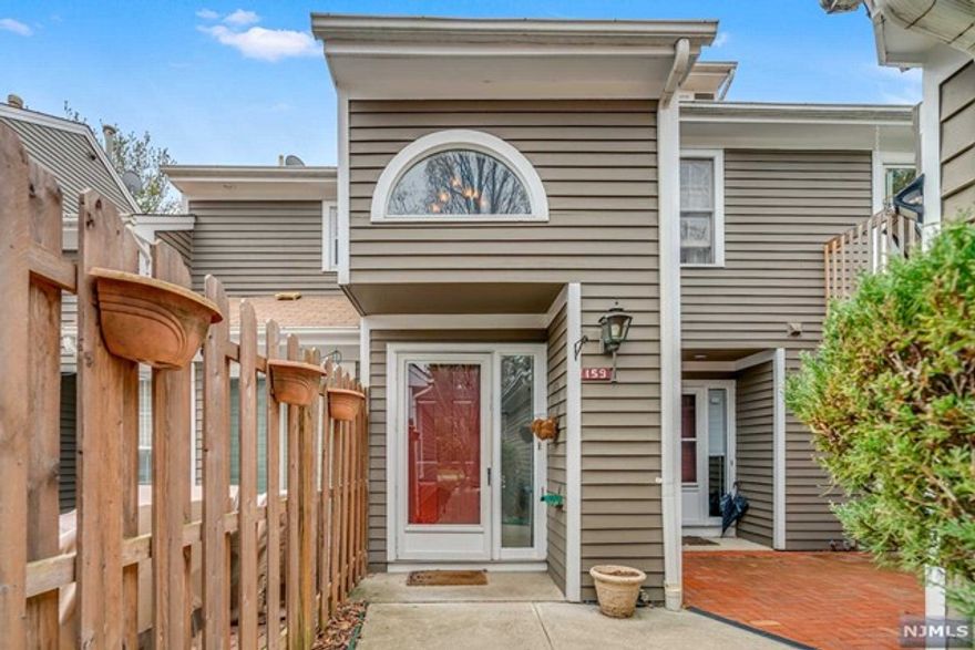 This turn key two level condo is now available and sits on a quiet cul-de-sac in Ramapo Ridge. This home has been updated and meticulously maintained and has such a comfortable at home feel. You will love the open kitchen to the living room with wood burning fireplace and vaulted ceiling. The spiral staircase leads to a loft overlooking the living room and serves as a flex area for a home office, playroom, exercise room, or guest room. The primary suite is spacious with an updated bath and views of the private woods. The 2nd bedroom is currently being used as a den. The spacious and newer deck is a great space for grilling or relaxing. Several windows have been replaced as well as the kitchen appliances, granite counters, heating, and A/C system. Ramapo Ridge offers an exercise room, pool, tennis, basketball, clubhouse, playroom and playground for kids. This is conveniently located next door to Darlington Park, Ramapo Reservation, shopping, all 4 schools, and the public library.