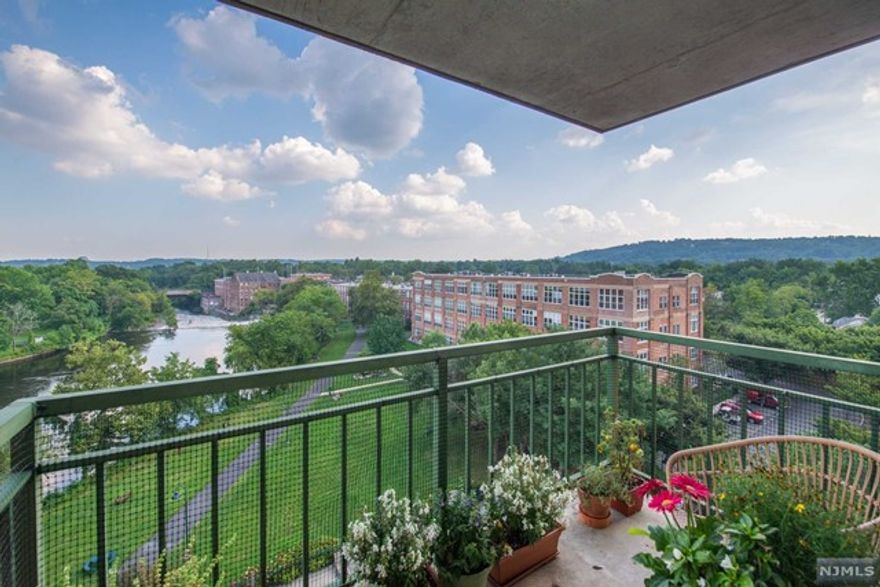 You truly can have it all! Luxurious corner unit, carefully renovated floor to ceiling, has exquisite views of both the falls and mountains. Step into the large living/dining room to be greeted by a mountain view from the balcony. Master bedroom, with a large walk-in closet & unique bathroom, has its own balcony overlooking the falls & pool. Updated kitchen has new cabinets including a pull-out pantry, stone floor, custom Bosch dishwasher & new appliances. Hall bath has retro basket-weave tile floor & gorgeous shower. An adjoining utility closet has a new stackable washer & dryer. Second bedroom is multi-functional with a one-of-a-kind Murphy bed/desk. Windows & exterior doors are brand new, double glazed, custom blinds, window treatments & valances. Generous closets. All-new, energy efficient heat pumps.