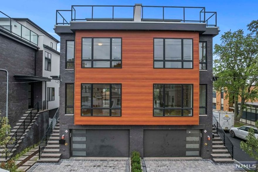 Brand New, Oversized Unit Located on Desirable Myrtle Ave. Each Townhome features Large & Open Floor Concepts Tied Together with South Facing Sunlight Exposures. Step Inside to 4 Bedrooms, 4.5 Bathrooms on 4 Levels of Living. Main Floor Introduces the Chefs Kitchen Equipped with Bosch Appliances, Custom Cabinetry, Waterfall Quartz Island, Walk Out Terrace, Entertainment Area + More. Living Room Area Welcomes South Facing Views, Tile Wrapped Fireplace, and Custom Shelving. Built In Speakers Throughout House. Second Floor Includes Primary Bedroom & Bathroom, 2 Addt Bedroom+ A Full Bathroom. Main Suite Includes Accent Wall, Closet Spaces, and Primary Bathroom- Dual Vanities, Soak in Tub, Wall Mounted Toilet+Quartz Wrapped & Kohler Faucets. Top Floor Includes Oversized Rooftop, Rec Room. Wet Bar Area & Half Bath- Perfect for Hosting! Ground Level Includes Bedroom with Full Bathroom, Large Rec Room, Wet Bar Area, Mudroom, Backyard and Garage. Near NJ Transit, GWB, Parks & Schools.