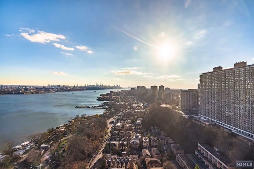 SPECTACULAR VIEWS!!!!!!! Enjoy amazing views of the Manhattan skyline, Hudson River ,views from every window. Spacious 2 bedroom bathed in sunlight. Faces directly south. Open floor plan with wood floors through-out All baths newly renovated. Beautiful, spa like master bath. Second bedroom with ensuite bath and a half bath. Two garage parking spots . Washer, dryer in unit. The Palisades is a full service luxury building located in the heart of Fort Lee. Enjoy a beautiful outdoor pool, gym, children's playroom, conference room and library. 24 hour concierge. Pet friendly building! Walking distance to shopping, restaurants and NYC transportation