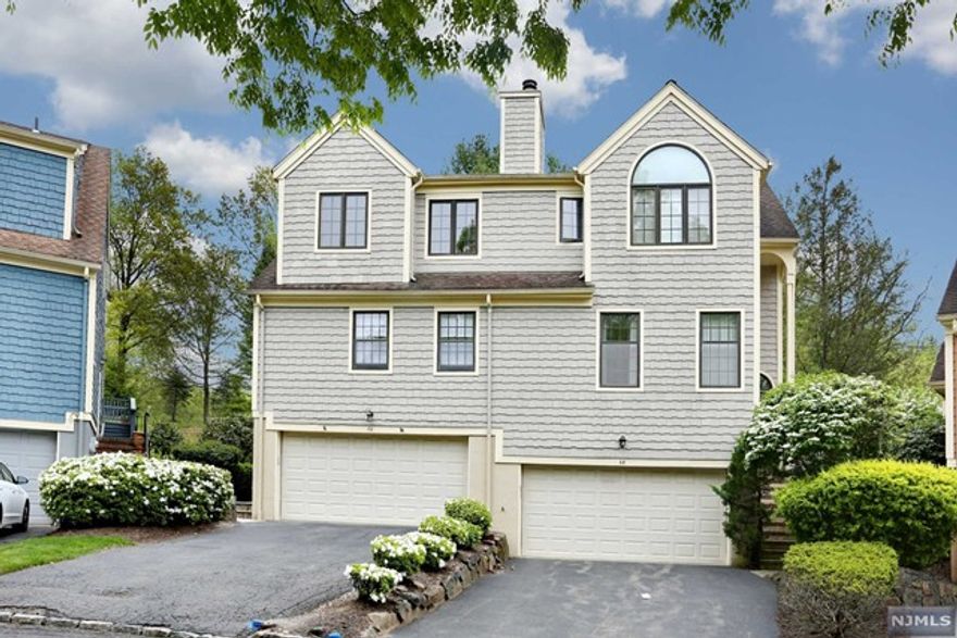 ONE OF THE MOST SOUGHT AFTER TOWNHOME DEVELOPMENTS IN WAYNE. HIGH MOUNTIAN VILLAGE, WITH OVER 2200 SQFT IN THIS UNIT. HAS A WRAP AROUND REAR DECK FRESHLY PAINTED. FIRST LEVEL FEATURES THE LIVING RM W/ BEAUTIFUL WOODBURNING FIREPLACE, CATHEDRAL CEILINGS, & FLOOR TO CEILING WINDOWS. DINING AREA OFF LIV.RM, KITCHEN W/SS APPLIANCES DW, MICRO/CONVECTION, REFRIG PLUS EATING AREA. MAIN BEDROOM W/PRIVATE BATH & DUAL SINKS, SOAKING TUB AND SEP.SHOWER. AMPLE CLOSETS ALL WITH HARDWOOD FLOORS. SECOND LEVEL HAS LOVELY SITTING AREA LOFT OVERLOOKING THE LIVING ROOM PLUS TWO LARGE BEDROOMS ALL WITH HARDWOOD FLOORS. ALSO UPSTAIRS THERE IS A FULL TILE BATH. LOWER LEVEL HAS A HUGE FAMILY ROOM WITH NEW CARPET & A HALF BATH PLUS SLIDING GLASS DOORS TO YARD, LAUNDRY, AND UTILTIES *** BIG PLUS! TWO CAR GARAGE WITH THREE CAR DRIVEWAY! *** CENTRAL AIR & CENTRAL VACCUUM BOTH NEWER. seller is a nj licensed real estate agent