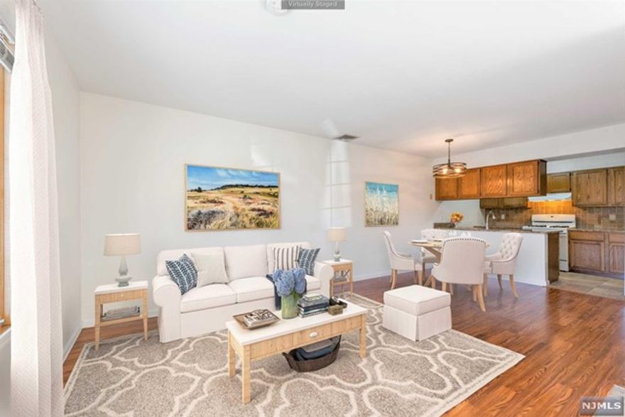 Spacious Commuter's Dream Townhouse within 10 miles of NYC. Located in the highly-sought after Willow Wood Square townhouse community just steps from NYC transportation, this two-level unit offers maximum space and comfort. The first floor offers an open living and dining areas and a half bathroom. Upstairs there is an oversized bedroom with large balcony, a full bathroom, and the laundry area. Additional highlights include central air & heat, an assigned parking space, and plenty of visitor parking. Offering an ideal commute to NYC and located just minutes to the best attractions in Northern New Jersey, including Metlife Stadium and the American Dream Mall, this townhouse offers the entire package. IMPORTANT: USE THIS ADDRESS FOR GPS: 93 Oak Street, East Rutherford, NJ, then look for Unit 32