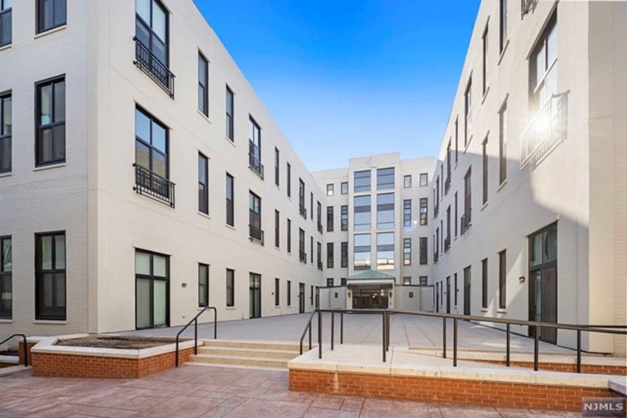 Welcome home to this 1bd/1ba loft at Gregory Commons! The kitchen features a Brand New Stove, Dishwasher, and Refrigerator. There is plenty of room for entertaining in the open floor plan living, dining, kitchen area. Enjoy the peace and quiet as there is no neighbor above or on the left side of this unit. The stairs, loft, and closet have been upgraded with hardwood floors for a seamless transition from the main floor of living. Windows have been recently replaced allowing an extra level of comfort. Amenities include 24hr concierge, health club, indoor pool, wash/dry room, and community room. Bus stop to NYC at your doorstep, close to restaurants and supermarkets! 1 assigned covered parking space located in the building garage included in sale! Management allows for in unit washer/dryer to be installed.