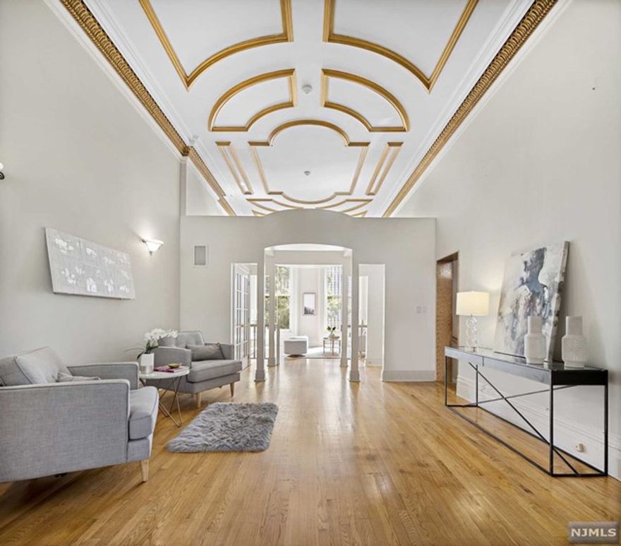 Rarely available 25 foot wide magnificent duplex condo located on the most desirable street in Hoboken. This spacious home encompasses 2,376 SF of living space, 3 bedrooms, 3 full bathrooms, a renovated front patio, covered deck leading to the yard, and 1 private off-street parking space. This condo exemplifies the seamless integration of old world historic details & timeless modern living & design. The parlor level features soaring 14 foot ceilings with original crown moldings, an open eat-in kitchen with Viking stove, Sub-zero refrigerator & a wine fridge, two living room areas, and a full bath. The garden level has 3 bedrooms & 2 full bathrooms - a large master bedroom with an en-suite bathroom with a jacuzzi & a walk-in closet, a second generously sized bedroom, and a third bedroom ideal for a nursery or a home office. Other features include a stained glass window, oak hardwood floors, a full size W/D, central heat & AC with a humidifier, & additional storage in the basement.