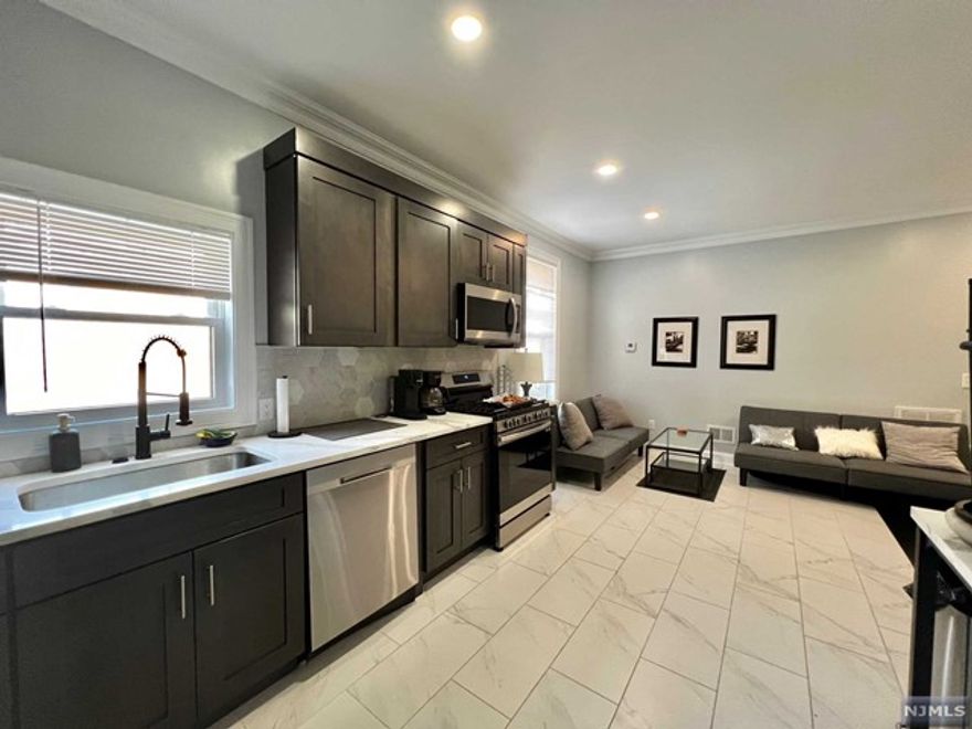 BEAUTIFUL NEWER CONSTRUCTION 2-BEDROOMS APARTMENT WITH 3 FULL BATHS (1ST FLOOR + BASEMENT)!! 1ST FLOOR: 2BEDS. 2BATHS. LIVING ROOM. KITCHEN, CONNECT TO BASEMENT: LAUNDRY WITH WASHER AND DRYER, 1 BATH AND BIG RECREATION FINISHED ROOM. (WITH PARKING $2950) MINUTES TO PATH TRAIN TO NEW YORK! CLOSE TO MAJOR TRANSPORTATION, RUTGERS UNIVERSITY, NJIT, SCHOOLS, WORSHIP, AND PARKS. TO MANY SURROUNDING STORES, RESTAURANTS, GROCERY STORES, AND MANY MORE. BY APPOINTMENT ONLY. AVAILABLE NOW. A MUST SEE!!