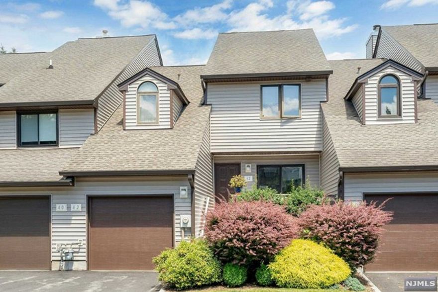 Welcome to West Essex Highlands of West Orange! Ideal 1st home/perfect downsize w/no maintenance & wonderful amenities w/clubhouse, pool, tennis, playground & basketball. Sun-filled townhome w/3 floors offers 3 BR & 2.5 BA. Open plan 1st fl w/ EIK w/slider to nestled veranda for alfresco dining. Adjacent FDR w/slider to patio. LR w/2 story skylight ceiling, WBFP & entertainment bar. Plus powder rm, garage & bsmt. Half level up BR/bonus. 2nd fl 2 BR, 2 BA. Primary suite w/hugr loft, walk-in & addl closets & BA w/soak tub & sep. shower. 2nd BR w/en-suite BA. Hi ceilings, CA, attached garage, hdwd & carpet, basement sliders to walk out patio, laundry & easy to finish. Near restaurants, shops, NYC transp, schools, worship. Enjoy West Orange Wonderful! Chimney/flue/liner, central vac as is not used, blinds/windows, carpet & microwave as-is. PREFER CLOSE BY SEPT, U&O FOR 1-2 MONTHS.