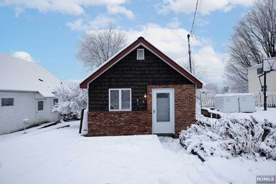 Ideally located is this quaint and efficient home. Enter into the living room which is steps away from the galley kitchen with custom cabinets, stove/oven and refrigerator. The bedroom with large closet is steps away from the full bath. The hallway opens up to the side door to the nice deck that overlooks the tranquil and peaceful backyard. Off of the porch, you will find a bonus utility room with washer and dryer. Membership in Upper Greenwood Lake Property Owners Association is included with this house and is paid for in full. Enjoy all that this wonderful lake community offers! UGLPOA.org