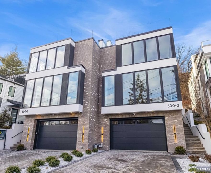 New construction luxury duplex. This oversized townhome w/ 4 levels, 4 Bedrooms, & 3 Full & 2 half baths is one of the Largest New Constructions in Edgewater, NJ, w/ Private Elevator, stunning views of the NYC skyline & the Hudson River. The 1st floor offers 11ft ceilings, an entrance foyer, a half bath, & Chef's gourmet kitchen w/ professional sub-zero/wolf stainless steel appliances & a huge prep island. The 2nd floor has 9ft ceilings, a laundry room, 2 bedrooms w/ a shared bathroom, & the primary suite, which includes a SPA-like bathroom w/ a free-standing tub & rain head shower, walk-in closets, & vanities w/ cabinetry. The roof terrace w/ a guest room, a full bathroom, a mechanical room, a rec room w/ a bar by ARREX, a fiberglass outdoor terrace w/ BBQ, & exterior glass railings are perfect for entertaining. The lower level also boasts high, 9 ft ceilings, an open plan layout, a half bath, storage, & a mechanical room. Oversized 2 car garage attached. See attached SPEC sheet.