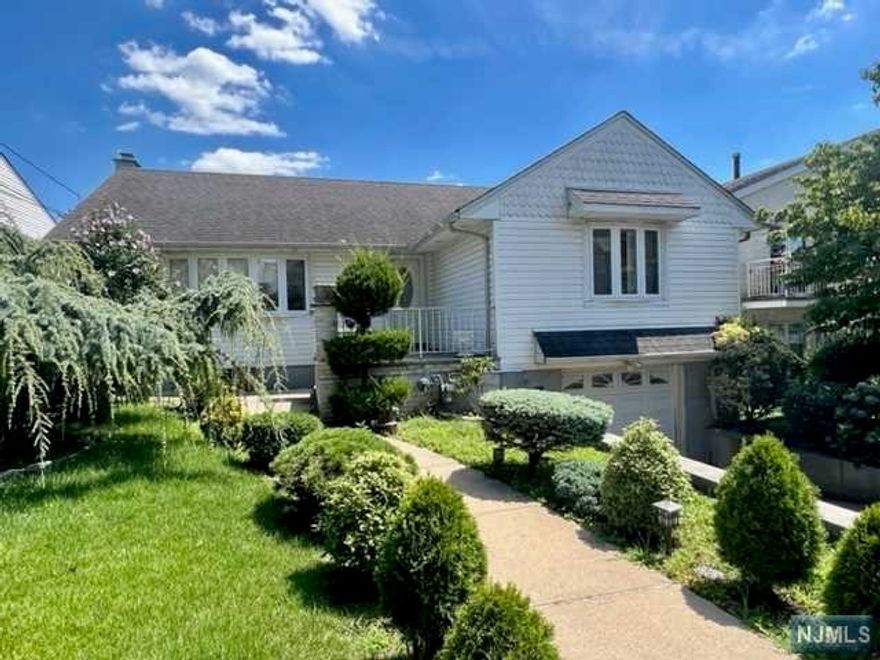 RENT THIS SPACIOUS HOME LOCATED WITIN WALKING DISTANCE TO NYC TRANSPORTATION, SCHOOLS AND SHOPPING. HOME FEATURES: LARGE LIVING ROOM, DINING ROOM, MODERN KITCHEN WITH DOOR LEADING TO GORGEOUS PRIVATE YARD. THREE HUGE BEDROOMS AND FULL BATH COMPLETE THE FIRST FLOOR. FULL FINISHED BASEMENT WITH FAMILY ROOM, BEDROOM, SUMMER KITCHEN AND FULL BATH. THIS HOME IS PERFECT FOR THE EXTENDED FAMILY. ATTACHED GARAGE AND OFF STREET PARK. BEAUTIFUL PRIVATE YARD COMPLETES THE EXTERIOR OF THIS VOLUMINOUS HOME.