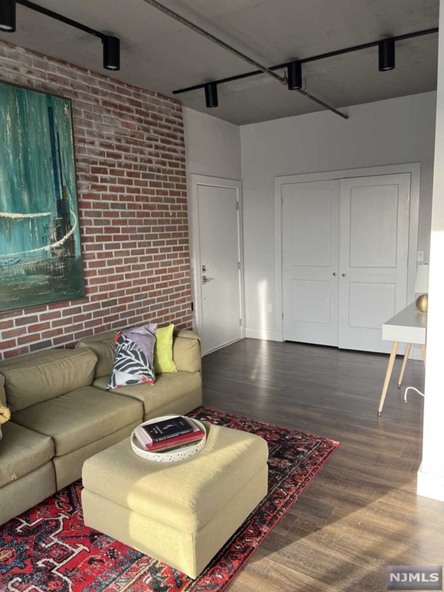 Welcome to 60 Elm Luxury loft-style apartments complete with spacious living areas, sky- high industrial cement ceilings, modern light fixtures, large windows. This 1 Bedroom and 1 bath NYC facing unit with open kitchen/living area with stainless steel appliances, closet space, stone countertops, wood floors, has 3 balconies, Air conditioning/ heating, Washer/dryer machine in unit. Secured with fob key access and security system in the building. Short distance to train, path, or bus. Building has a roof top garden as well as a roof top eatting area. There is a gym and recreational area in the building.