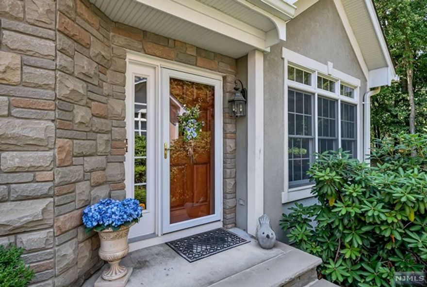 Exquisitely beautiful end unit in the sought after Summit Ridge! No detail spared and decorator perfect! 2 story Entry Foyer leads you to stunning living room with walls of windows, accent lighting and gas fireplace. Lovely dining room leads to the glorious and updated kitchen with granite counters and stainless appliances. Convenient bar top seating plus light and bright breakfast nook with built in seating. Custom Plantation shutters. Family Room features dual fireplace to living room, recessed lighting, and door to inviting and private rear patio. Updated guest powder room. Gorgeous wood floors on 1st floor! 2nd floor boasts 3 spacious bedrooms including the primary suite with 2 walk in closets, lavish bath and tray ceiling. Full bath off hallway. 2nd floor balcony overlooks living rm. Modern and gorgeous finished lower level with built-ins, crown moldings, rec room, gym, full bath, laundry and storage! 2 car attached garage. What a glorious place to call home!