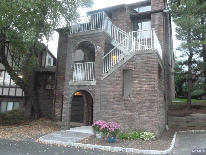 Two Floor Condo Unit approx. 1562sqft. featuring 2 BR, 2 full Bath, Liv Room/Dining Room Combo, Eat in Kitchen, Laundry Room, Sliding Doors to large Deck. Second level offers Living/Family Room w/ fireplace and office/rec room. Central Air & Quick Access to Rt #3 & Rt 46 & NY Bus.