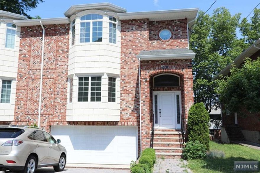 Over size duplex Located in a very nice quite area of Fort Lee. Including: Modern Custom Made Kitchen, Granite Counter Kitchen, Granite Counter Tops and Stainless Appliances. Speciously Living Room, Dinning Room. Mater bedroom with master bathrooms, In-law suite with private bathroom. 2 Bedroom, one full bath, 2 half bath, 2 Full Size Car Garage, Large Deck, Security System, Center Air, and Center Vacuum System, Etc. Cannot miss