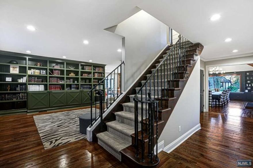 Truly one-of-a-kind home on oversized park like lot. This 8 Bedroom 6.5 Bathroom house has been fully renovated with high end designer finishes. This home is only 2yrs old on the original foundation. Home features chefs eat in kitchen with high end appliances, walk in pantry, DR with double height ceilings and Bar, formal LR with Woodburning Fireplace, Family room and sunroom. Great house for entertaining both inside and outside. Outside features patio with outdoor kitchen, In-ground heated pool and hot tub. This is a MUST SEE to appreciate! Seller holds NJ RE License