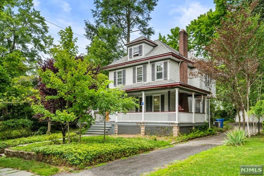 Located in the desirable East Hill of Tenafly, this beautifully renovated Colonial features a wrap-around porch, 3 BR and 2 full Baths. The home opens into a lovely foyer leading into the formal living room with fireplace and built-in bookshelves, a spacious dining room and updated kitchen with new appliances and ample cabinets. Also featured in this move-in ready home are original hardwood floors throughout, high ceilings and crown moldings. The second floor includes the primary bedroom w/ en-suite bath and a spacious second bedroom, second full bath and home office. On the third floor, you will find a private third bedroom/additional home office area. Tenafly is a family-friendly community with top-ranked schools, easy access to NYC buses, restaurants, shopping and houses of worship.