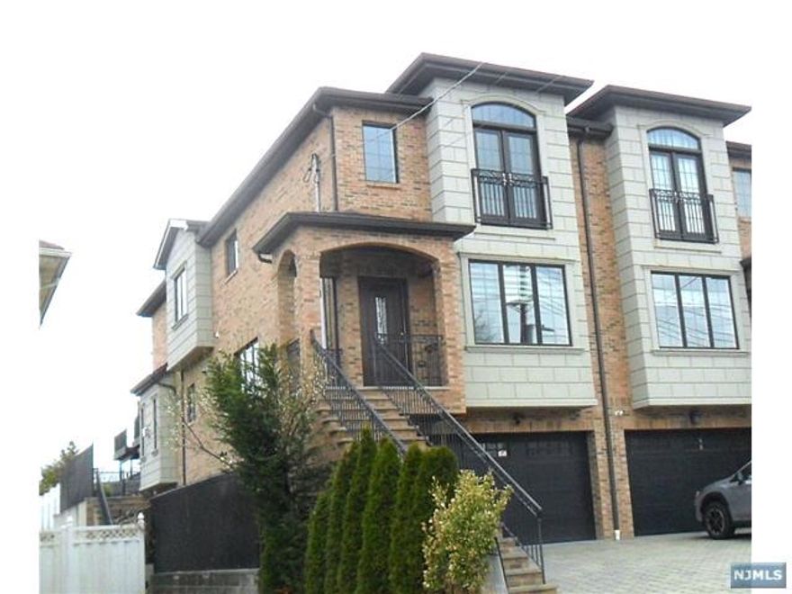 OVERSIZED ALL BRICK DUPLEX BUILT IN 2015, LOCATED HEART OF FORT LEE SO CLOSE TO EVERTHING LIBRARY, SCHOOL, WORSIP, MAIN STREET, EVEN MARKET VERY CONVIENCE, NYC TRANSPORTATAION COPNVIENTLY AT DOOR STEP. LIVING RROOM WITH FIRE PLACE , DINING ROOM, MODERN AND LARGE KITCHEN WITH ISLAND, QUARTZ COUNTERTOPS AND STAINLESS STEEL APPLIANCES FAMILY ROOM LEADING TO PATIO WITH SLIDING GLASS DOOR WHICH HAS A BEAUTIFUL PRIVATE FENCED BACK YARD, MBR WITH WALKIN CLOSET, MBATH WITH DOUBLE VANITY SINKS ,JACCUZI TUB, AND SEPERATE SHOWER STALL PLUS AN ADDITIONLAL TWO BEDROOMS WITH FULL BATH IN HALLWAY,AND LAUNDRY ROOM .GROUND LEVEL HAS SIDE ENTRY DOOR WITH RECREATION ROOM, OFFICE OR BEDROOM WITH HALF BATHROOM ADDITIONNAL FEATURES INCLUDE MULTIZONE HEATING AND CAC RECCESSED LIGHTING PAVER DRIVEWAY AND WALK WAY TWO CAR GARAGE AND TWO PARKING SPACES