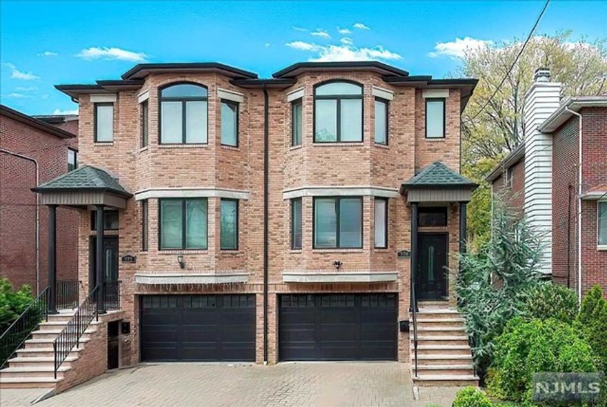 Beautiful, spacious 4 BR, 2 full and 2 half bath duplex for sale in desirable Cliffside Park neighborhood within blocks to shopping, schools, top restaurants, supermarkets and NYC transportation (bus 154 and 159R). Built in 2015. Close to GWB, NY Waterway and all major highways for easy commute. Newer tri-level townhouse with open floor plan, hardwood floors throughout, living room with gas fireplace, 3 zone heating, 1 zone central cooling, gourmet chef kitchen with wet bar, updated baths, large deck, big bedrooms, attached garage and full, finished basement with 4th bedroom and entrance to private fenced yard. Large primary bedroom with custom closet and en suite bath including jacuzzi and shower. 2nd floor laundry room near 3 bedrooms. Excellent insulation and solar panels for low-cost utilities and energy savings. Well-maintained home with newer water heater (2022), near new gas fireplace and beautiful Levolor top-down bottom-up shades on all win