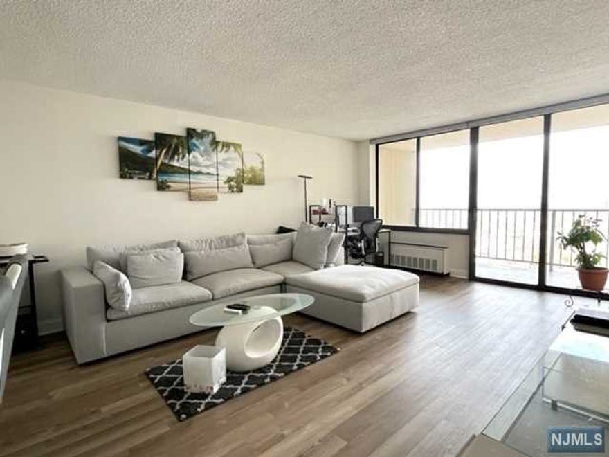 MOVE IN READY!! FULLY RENOVATED 2 BED 2 BATH CONDO IN A LUXURY HIGH-RISE BUILDING. HIGH FLOOR WITH BEAUTIFUL TOWN VIEW. SPACIOUS , BRIGHT AND HAS COUSTOM AOK WOOD FLOOR THROUGHOUT. CUSTOM DESIGNED KITCHEN WITH STAINLESS APPLIANCES. MASTER BEDROOM HAS EN-SUITE SEPARATE VANITY AREA WITH FULLY RENOVATED BATHROOM. WALK-IN CLOSETS AND EXTRA STORAGE ON SAME FLOOR.24HR DOORMAN/SECURITY. POOL, TENNIS, PLAYGROUNDS, WALKING PATHS, CABLE TV PACKAGE, HIGH SPEED INTERNET. PARKING FEE $70 ONE CAR/$125 TANDEM. nO ASSESSMENT. EASY ACCESS. BUS TO NYC AT DOORSTEP.