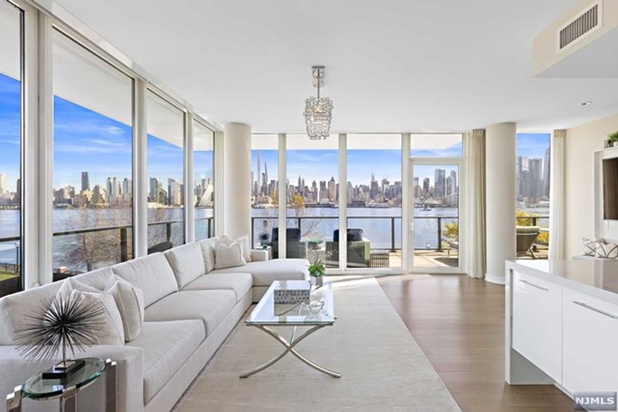 AVENUE COLLECTION - The wait for that perfect front row unit is over! Residence 307 in the prestigious 1200 Building offers 1938-sf on the front tip with the most spectacular unobstructed direct views of Midtown Manhattan and the Hudson River. This incredible home provides 3 bedrooms and 3 full bathrooms plus almost 700-sf of wrap around glass walled terrace space that simply must be seen. Inside this designer showcase, significant improvements include custom Lutron lighting, automated window blinds and clever built-in wall systems. Gorgeous finish details include custom selected hardware, luminous light fixtures and exquisite fabrics. A gas fireplace, 2 tandem parking spaces and 2 storage units complete this once in a lifetime opportunity. Experience all this plus the signature Building 1200 amenities that include 24-hour concierge, health club, theatre, sky lounge and the magnificent 3rd level pool deck.