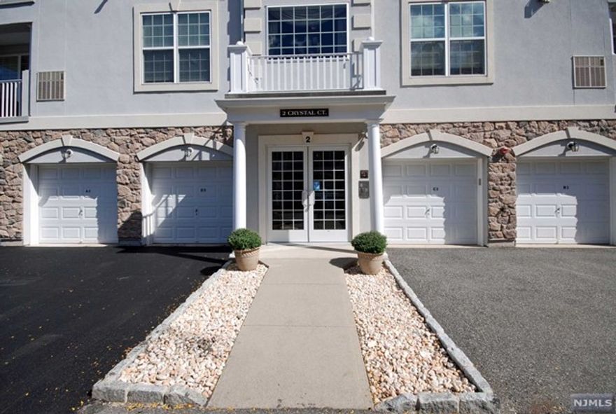 Highly desired top floor IRIS II with over $80k in upgrades & finishes! This open & airy layout offers the space you want all on one level. The MBR suite has a tray ceiling, 2 walk-in closets & luxurious bathroom. The 2nd/guest bedroom is full of natural light plus another walk-in closet. An impressive gourmet kitchen with all the bells & whistles. Featuring hardwood floors, upscale lighting, specialty tiles, private garage w/storage room & balcony with a view of the scenic grounds! The den provides an extra room perfect for an office. Resort style living with a 25,000 sq. ft. clubhouse w/indoor/outdoor pools, fitness center, putting/driving, card rooms/Mahjong, activities, clubs, etc. Bordering Montclair with great restaurants, theaters & boutiques. Enjoy a comfortable lifestyle in this premier gated community!