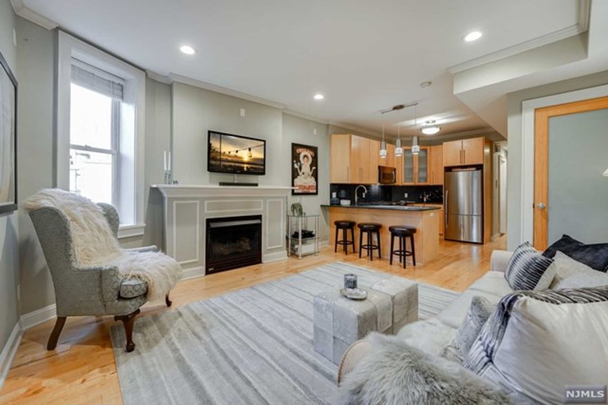 Beautiful 2 bed 1 bath condo in the heart of Hoboken full with modern amenities, handcrafted fireplace mantle, and crown molding beautifully accenting the 9ft high ceilings. Modern kitchen perfect for entertaining with stainless steel appliances and dishwasher. Both bedrooms on opposite ends of the unit are spacious and have great sized closets. Central AC/heat, energy efficient Nest thermostat, in-unit washer and dryer, and surround sound wiring, with wide plank hardwood floors throughout. Bonus area in the hallway can be used as an office, workout area, or whatever suits your needs. Short walking distance to PATH, NY Waterway ferries, commuter rail, Light Rail and NJ Transit buses. Parking is available on Hudson Street at the garages just steps away for a monthly fee. Washer and dryer in unit.