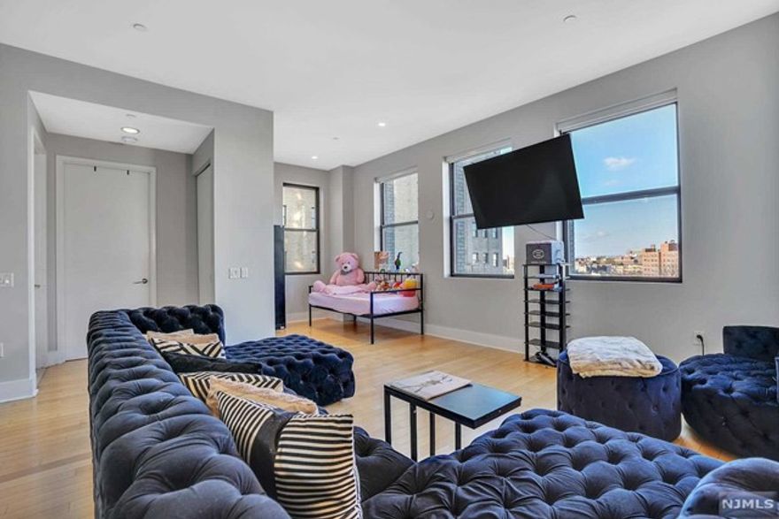 Located in the Rialto-Capitol Building, a perfectly laid out & open 830sf 1BR floor plan with lofty 12' ceilings, beautifully modern kitchen & a contemporary bathroom. Luxuriate in the floor-to-ceiling marble tile bathroom with combined bath & shower; keep comfortable with central heat & A/C; cook gourmet meals in the fully equipped kitchen with complete SS package of refrigerator, dishwasher, microwave & gas oven/range; entertain & create memories with conversation in the open living/dining area; & feel secure in this gated collective with a 24-hour concierge & all the services & an abundance of amenities you could desire. Formerly the Jersey City Medical Center, The Beacon is a collection of Art Deco buildings that were restored & converted to luxury living residences, resplendent stylish living & retail space. Be a part of this richly historic & architecturally significant landmark in the City of Jersey City, where you can 'Make It Yours' & 'Let The Beacon Light Your Way Home.'