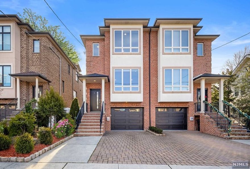 Contact Listing Agent Ryan D'Errico 201-988-4670 to see this stunning newer construction home in Cliffside Park - Updated in 2024, this luxury townhouse blends modern elegance with convenience. Step inside to an open-concept living area with a chic gas fireplace and sophisticated wainscoting. The large kitchen features sleek quartz countertops, shaker cabinetry, a wet bar, wine fridge, new appliances, and a custom pantry. The expansive Trex Deck is perfect for entertaining, overlooking a private, custom turf yard. The primary bedroom offers a sanctuary with high tray ceilings and a luxurious ensuite bath with marble finishes. The walk-out basement with a full bathroom adds versatile space. All Brick Exterior. Located on a wide quiet street surrounded by newer homes, you're minutes from GW Bridge and steps from express buses, Anderson Ave shopping, Town Centre, and Abbott Blvd walking path. Combining luxury living with an effortless Manhattan commute and low taxes.