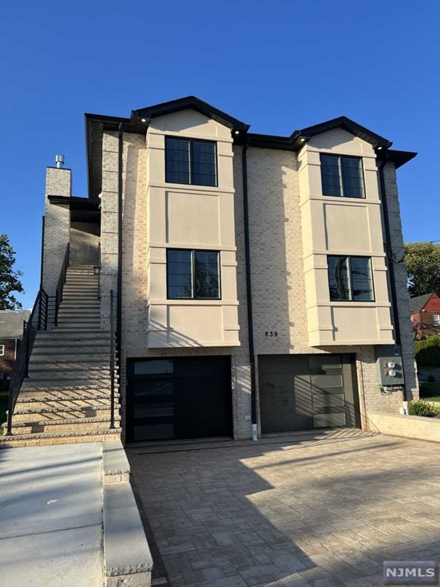 2nd floor apartment located in the best area of town just steps away from NYC transportation. Large open concept living/dining/kitchen area featuring hardwood floors throughout and in unit laundry. Spacious master bedroom with full bath and walk in closet. Two additional bedrooms and full bath complete this 1700+ square foot unit. 2 parking spaces in driveway plus one car garage. Tenant responsible for all utilities.