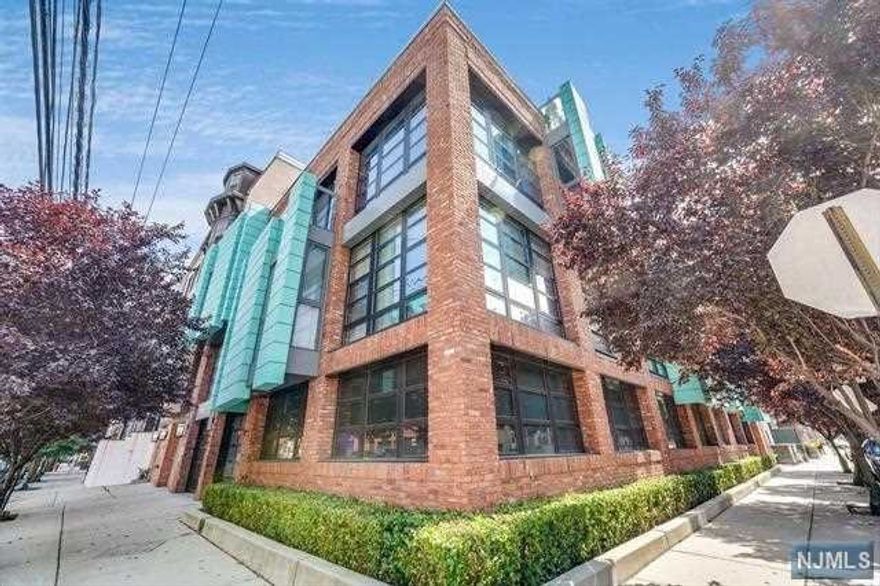 Welcome to The Jefferson, one of the most highly coveted concrete and steel boutique buildings in Hoboken! This meticulously designed and maintained 3 bedroom, 2 bathroom unit offers an unparalleled level of luxury and an array of exclusive features, making it the epitome of refined elegance. As you enter this remarkable home through the direct access elevator, you'll immediately be captivated by the seamless blend of high-end finishes and contemporary design. The spacious open-concept layout is adorned with wide plank herringbone oak hardwood floors, the gourmet kitchen features European-inspired design and top-of-the-line Thermador appliances, Quartz countertops and a large island. A wine dispenser and wine refrigerator completes the well-appointed kitchen. This home features three oversized bedrooms with custom California Closets, Hunter Douglas blinds, and modern bathrooms with Porcelanosa tile. Two spacious, private terraces allow for indoor/outdoor living.