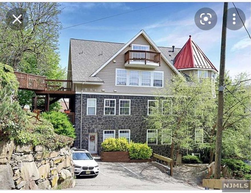 Unique home feels like a mountain vacation home. Beautifully renovated and completely rebuilt (ground up) house. Has beautiful new hardwood floors, central air, and nice views. Good ceiling height and lots of sunlight too. Great central Edgewater location. Close to bus stop, Post office, SOJO, Mitsuwa, more.