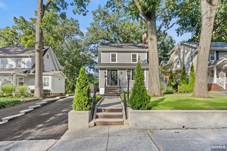 Discover this charming Colonial on a tree-lined street in the desirable Spring Garden section of Nutley. Freshly renovated, it offers a formal dining room, a cozy living room with a wood-burning fireplace, a spacious eat-in kitchen (EIK), a full bath, and a large family room. Upstairs, three bedrooms, a full bath, and a finished attic await. The basement provides extra space. Stay comfortable with central air and enjoy a new deck and patio. Convenient to NY transportation and Hackensack/Seton Hall Medical School.