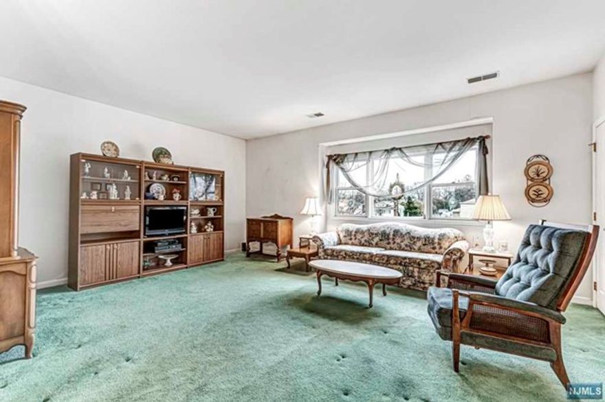 Low Taxes/Low Maintenance... Welcome to Brookside Commons "Over 55+ Community" located in Saddle Brook. Second floor unit featuring lots of light and high ceilings. Open living room and dining room concept. Leads into kitchen with large breakfast bar and in unit laundry. Two spacious bedrooms with extra- large closets. Each bedroom has balcony access overlooking beautiful park like setting. Lots of additional closet space and attic for storage. C/A/C and forced hot air heat. Two designated outdoor parking spaces and additional guest parking. Close to all highways and shopping. Bus to NYC right at the corner.