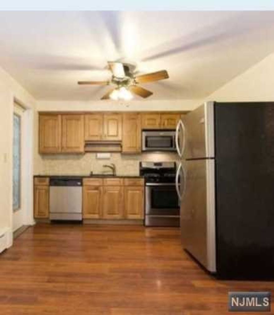 First floor unit conveniently located to public transportation. Screened Porch, Newer Kitchen w/Granite Stainless Steel Appliances, Hardwood Floors Throughout, 2 Bedrooms, Full Bath w Tub. Shared W/D in Basement with dry, storage space. 2 Assigned parking spaces. Heat & hot water included in the rent. Tenant responsible for snow removal, landlord responsible for lawn care. Tenant pays cooking gas and electric.