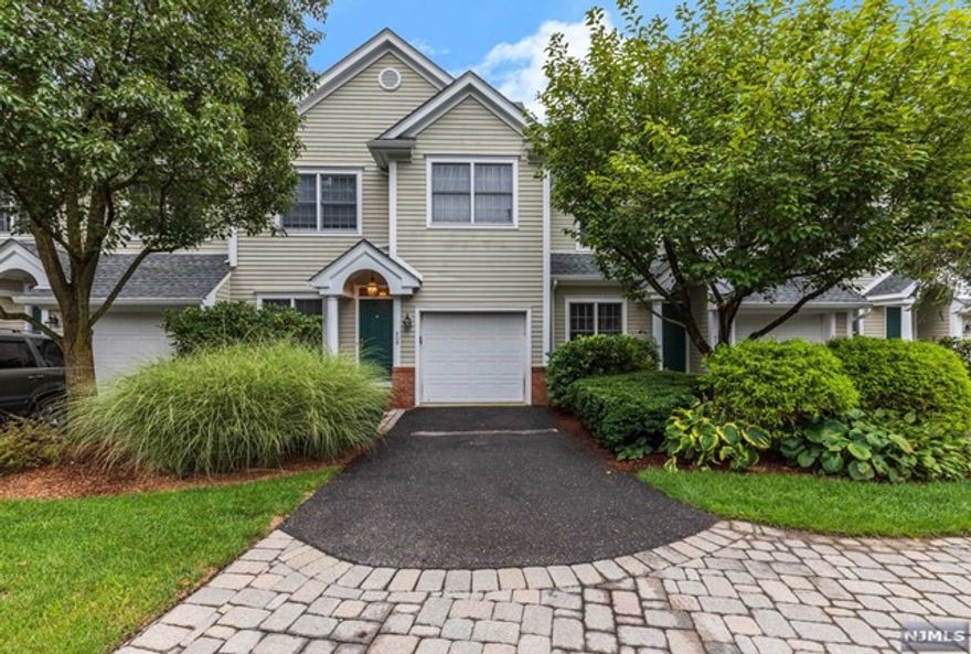 WELL MAINTAINED,DECORATED WITH MANY FINE APPOINTMENT AND DETAILS. HARDWOOD FLOORS AND CROWN MOLDING THRU-OUT! GORGEOUS MASTER SUIT W/W-I-C,MARBLE MASTER BATH/WHIRLPOOL TUB AND SHOWER. LIVING RM W/FIREPLACE.MODERN EAT KITCHEN AND BREAKFAST AREA.FAMILY ROOM/LIBRARY WITH DOOR TO DECK. HUGE MASTER BEDROOM SUITE WITH LUXURIOUS MASTER BATHROOM. FULL HALL BATH AND TWO OTHER BEDROOMS.2ND FLOOR LAUNDRY.LOTS OF CLOSETS AND STORAGE SPACES. WALK OUT BASEMENT LEADS OUT TO A PRIVATE PATIO AND BACKYARD OVERLOOKING WOODS, RAVINE AND VIEWS.CLOSE TO COOLIDGE ELEMENTARY SCHOOL, AND CLOSE TO NYC TRANSPORTATION.