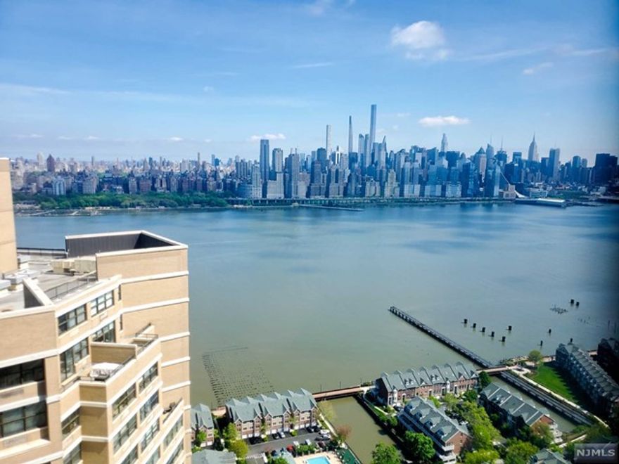 Looking for a place to make your very own? This is it. Bring your ideas, imagination and tools to turn around this 49th floor with magnificent NYC views. Located in the popular Galaxy 1 tower with all needed amenities at your door, the location is se.t, just needs a vision for inside. Spa, fitness center, pool and courts onsite, pet friendly, 24 hr security and wonderful maintenance and admin staff, easy shopping and a dream commute to NYC. Storage available with waitlist. Move in fees include 3 months HOA plus $250 admin. Can't wait to see what you make it!